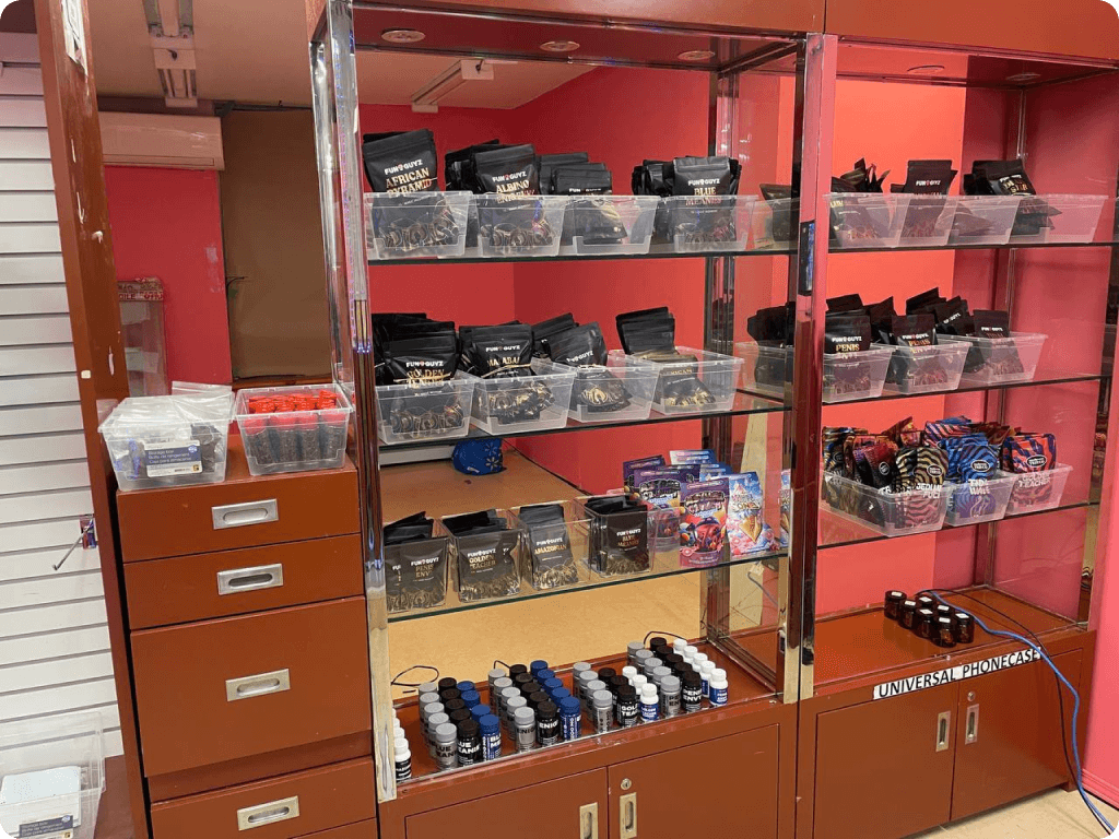 Products and dried magic mushrooms on store shelves at FunGuyz — Magic Mushroom Dispensary at 133 Dunlop Street