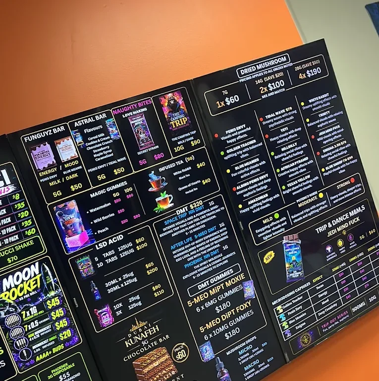 Close-up of the Funguyz Enfield Pl menu board showing strains, edibles and prices in Mississauga