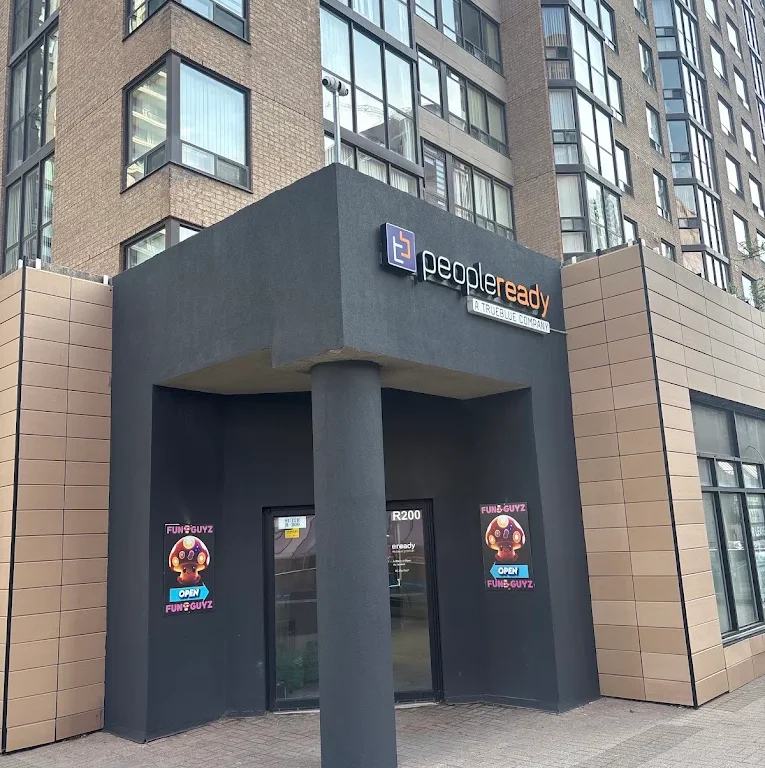 Funguyz magic mushroom dispensary entrance at 265 Enfield Pl, Mississauga, seen from the street in daylight