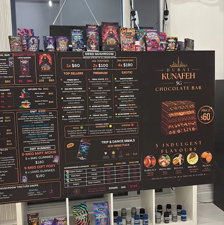Funguyz Fort York Blvd menu board In-store menu boards listing dried mushrooms, edibles, DMT and microdose capsules at Funguyz Fort York Blvd