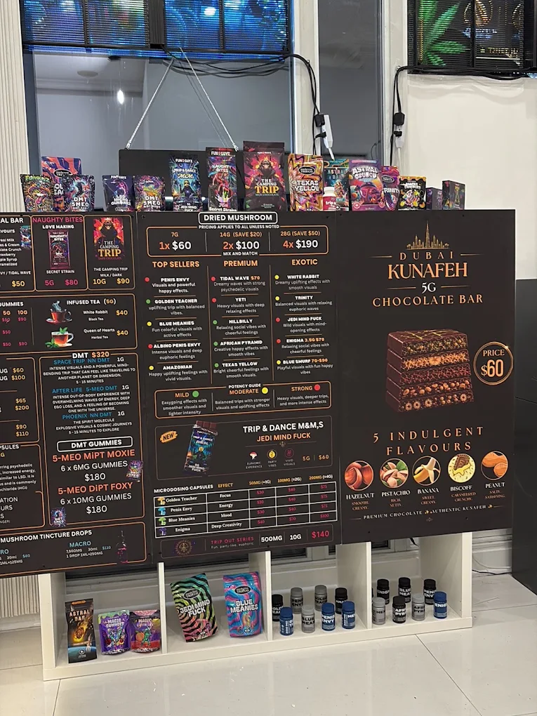 Funguyz Fort York Blvd menu board In-store menu boards listing dried mushrooms, edibles, DMT and microdose capsules at Funguyz Fort York Blvd