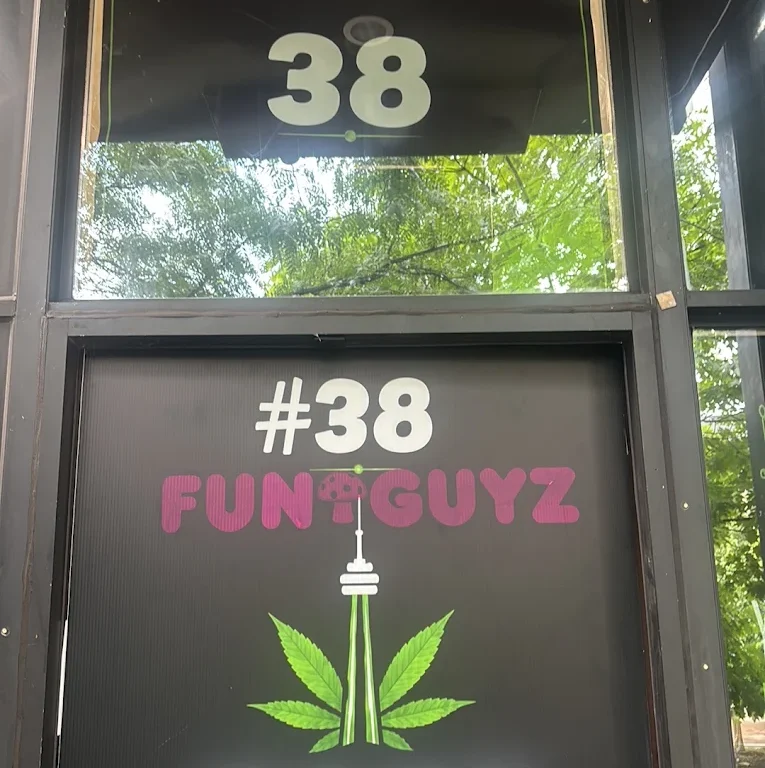Funguyz Fort York Blvd window sign Funguyz #38 window decal with the CN Tower logo at the Fort York Blvd store entrance in Toronto