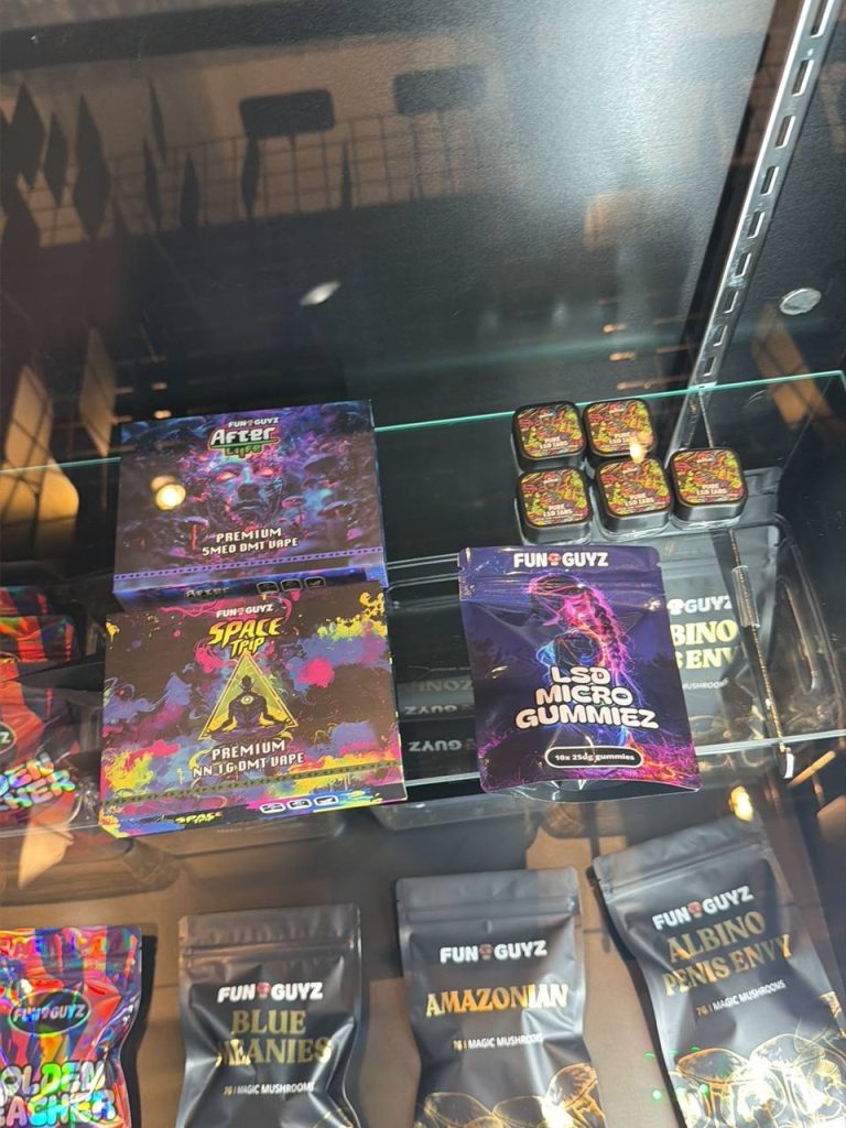 Dried magic mushrooms, gummies and DMT vapes on display at FunGuyz 518 Queen St West