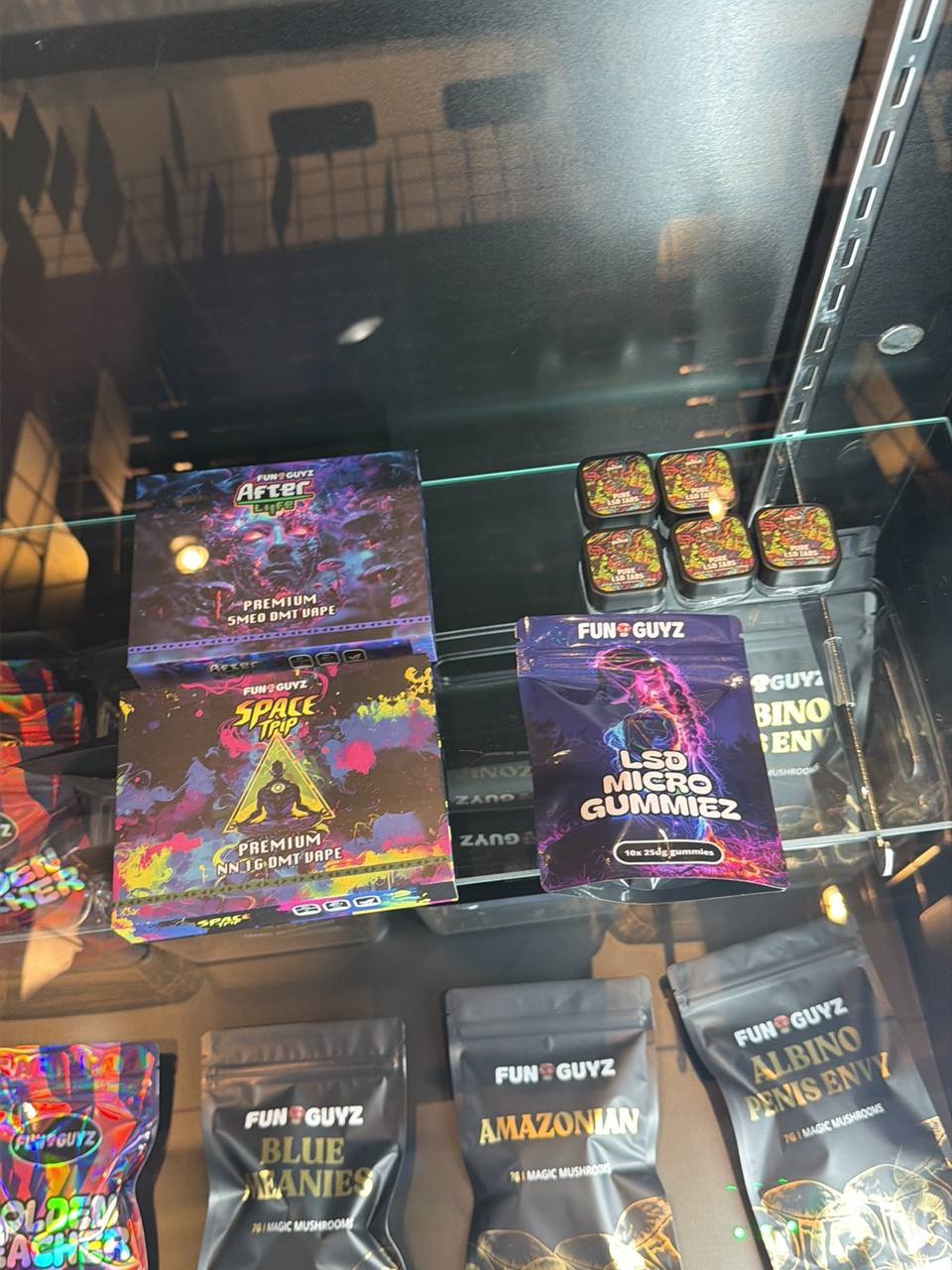 Dried magic mushrooms, gummies and DMT vapes on display at FunGuyz 518 Queen St West