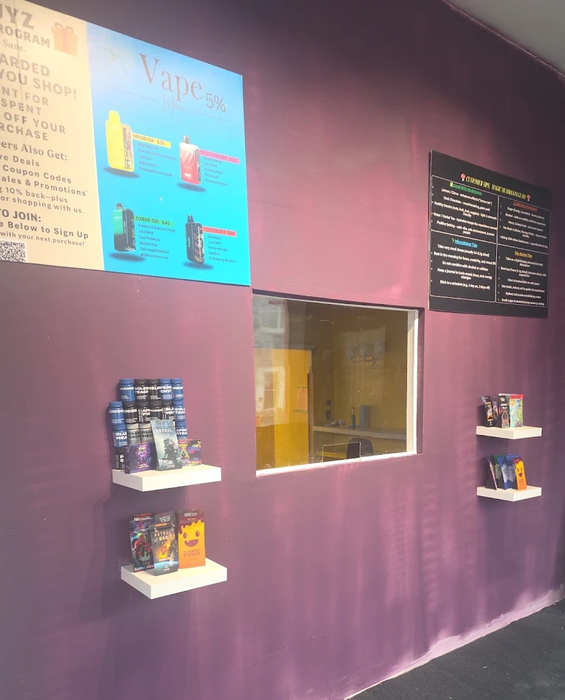 Product shelves and vape menu inside FunGuyz on Barton St East, Hamilton